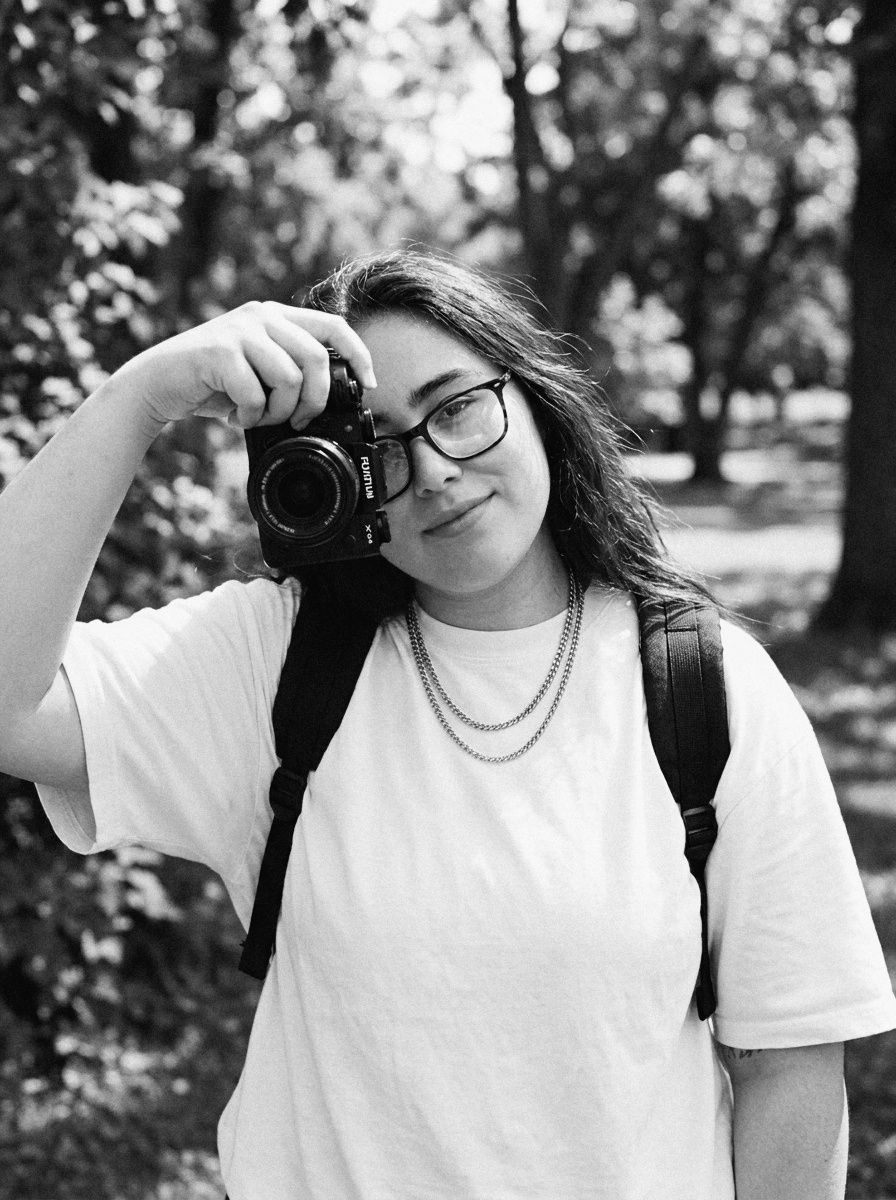 Kaitlyn Melendez holding a camera